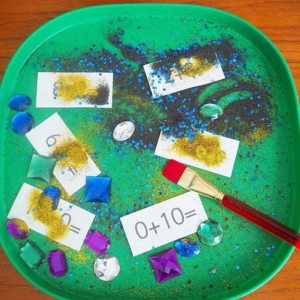 Hidden number bonds ~ use a brush to reveal the number bond number sentences hidden under coloured sand & glitter. Print out is on my website
