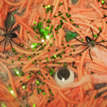 spaghetti glitter objects in sensory play for halloween