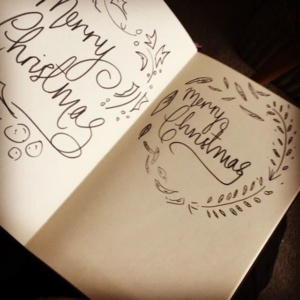 Deciding on Christmas card designs. Nap time drawing