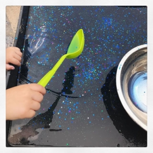 Magic Potion  Glitter + sparkles added to water with a tiny bit of Brusho to colour the water (may have added too much as we had blue hands!). A great way to add some sparkle to the water play. I know it’s raining but you can still enjoy the outside.