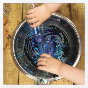 Recycled bottles // you don’t need any fancy equipment for water play. Rex is happy with plastic bottles for pouring and mixing.