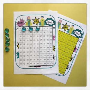 Hundred squares ️a superhero classroom resource️There are lots of different styles on harrietandviolet.com I make printables with plain + coloured backgrounds. Coloured backgrounds can help some children to read. Recently added to the site are lots of new hundred squares with counting in 2s 3s 5s and 10s. Great for an activity or enlarge to A3 for a display. Here I’ve used glass beads as counters to support counting. Link in bio