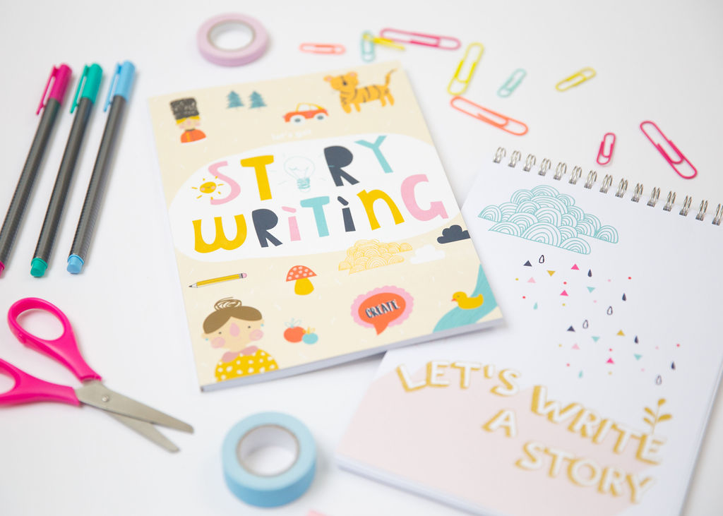 little writing company book flat lay with tape pens scissors