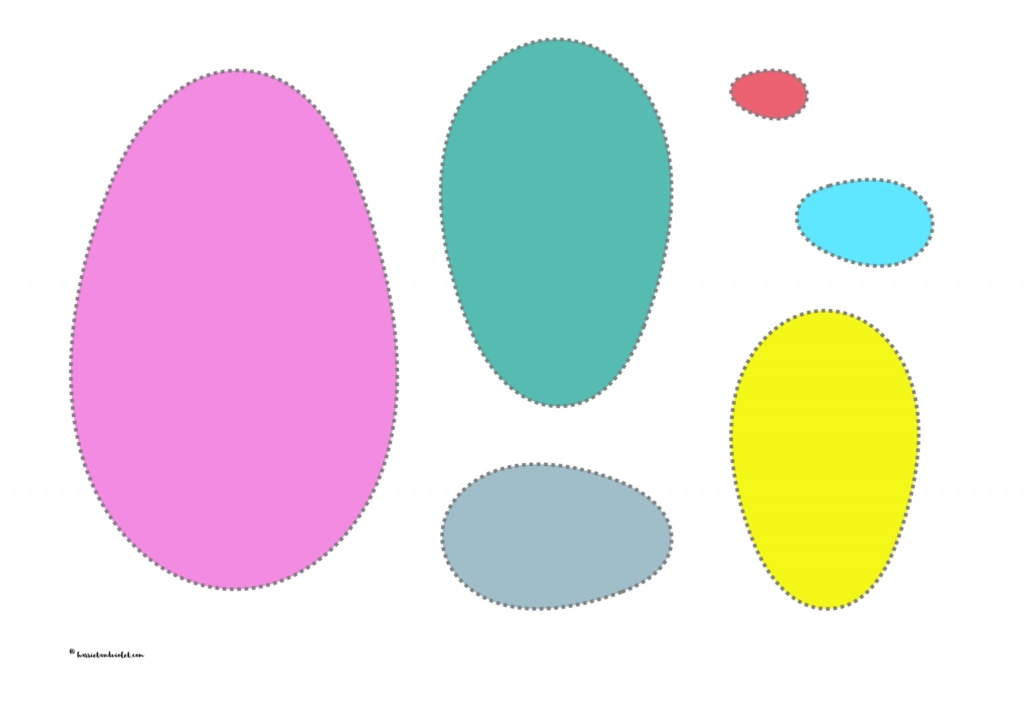different sized eggs and Easter egg different coloured eggs to cut